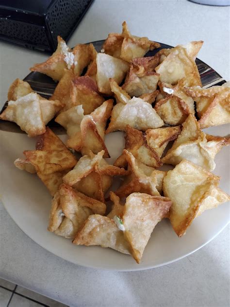 Spray with olive oil (optional, but makes a crispier rangoon), and fry at 350F for 3-4 minutes. . Right in front of my crab rangoons